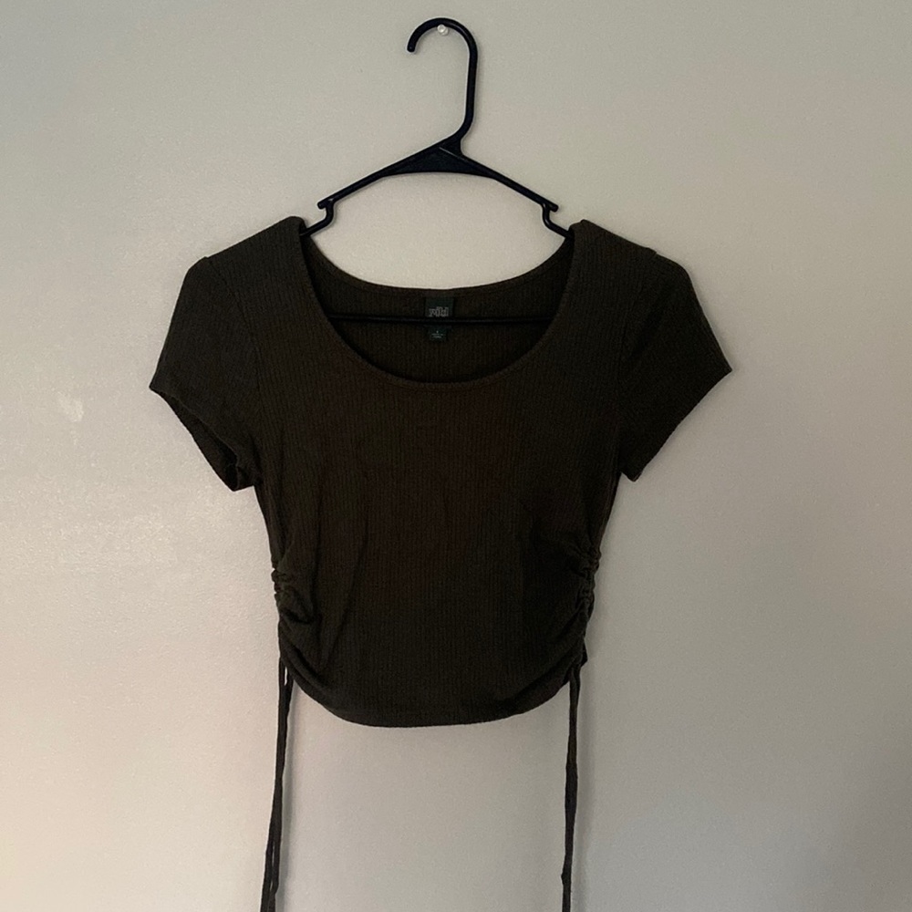 Hi! today I am selling a olive green tee that ties on the side:)